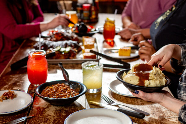 table filled bbq plates and cocktails