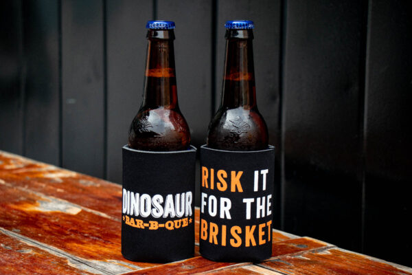 Risk It For The Brisket Beverage Holder on bottles of beer