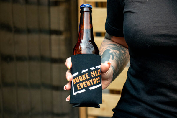 Smoke Meat Everyday Beverage Buddy on bottle of beer being held