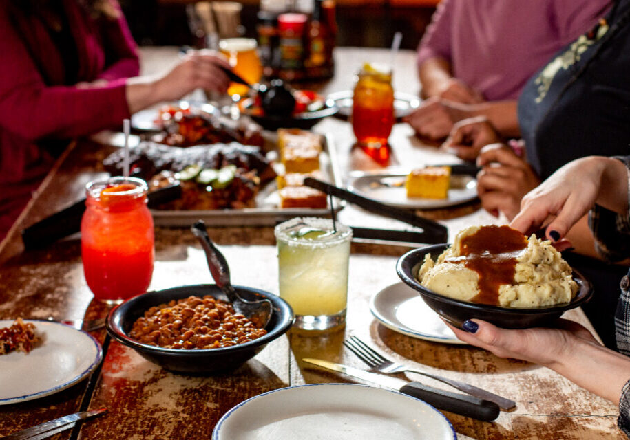 table filled bbq plates and cocktails
